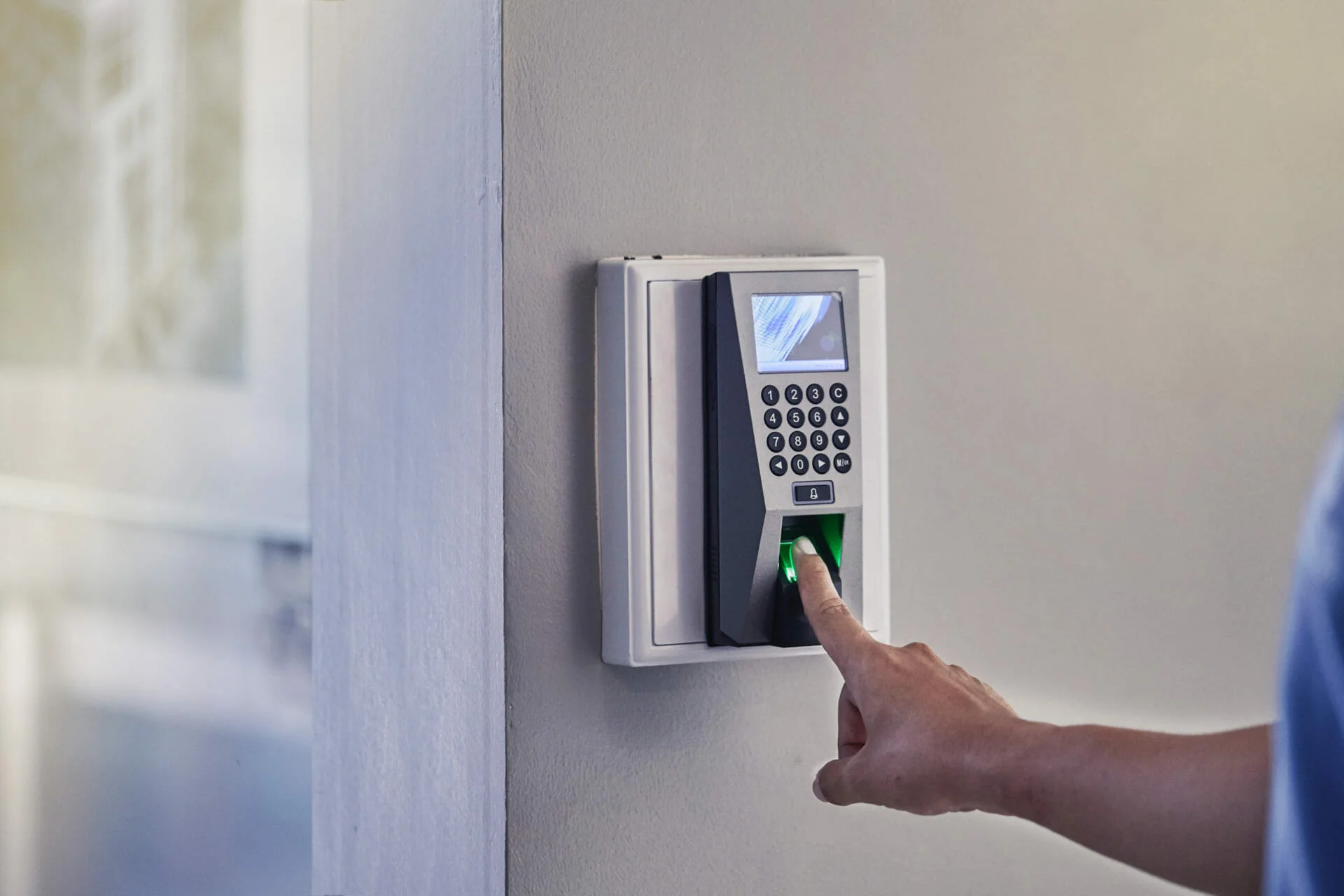 A high tech finger print scanner that was installed by a commercial locksmith